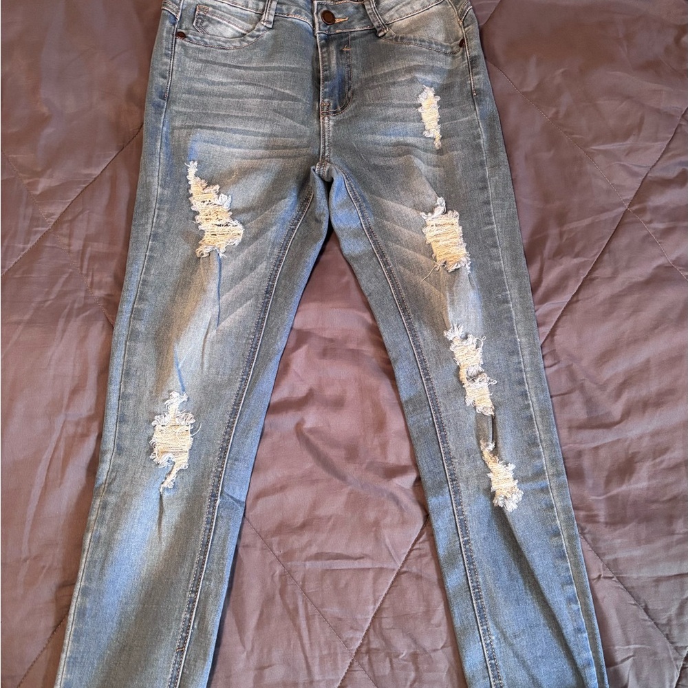 Women's Distressed Light Blue Jeans